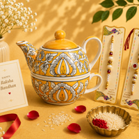 Athena Home Raksha Bandhan Gift Combo | Yellow Handpainted Ceramic Teapot with Cup Set, 2 Designer Rakhis | Premium Tea Gift Hamper